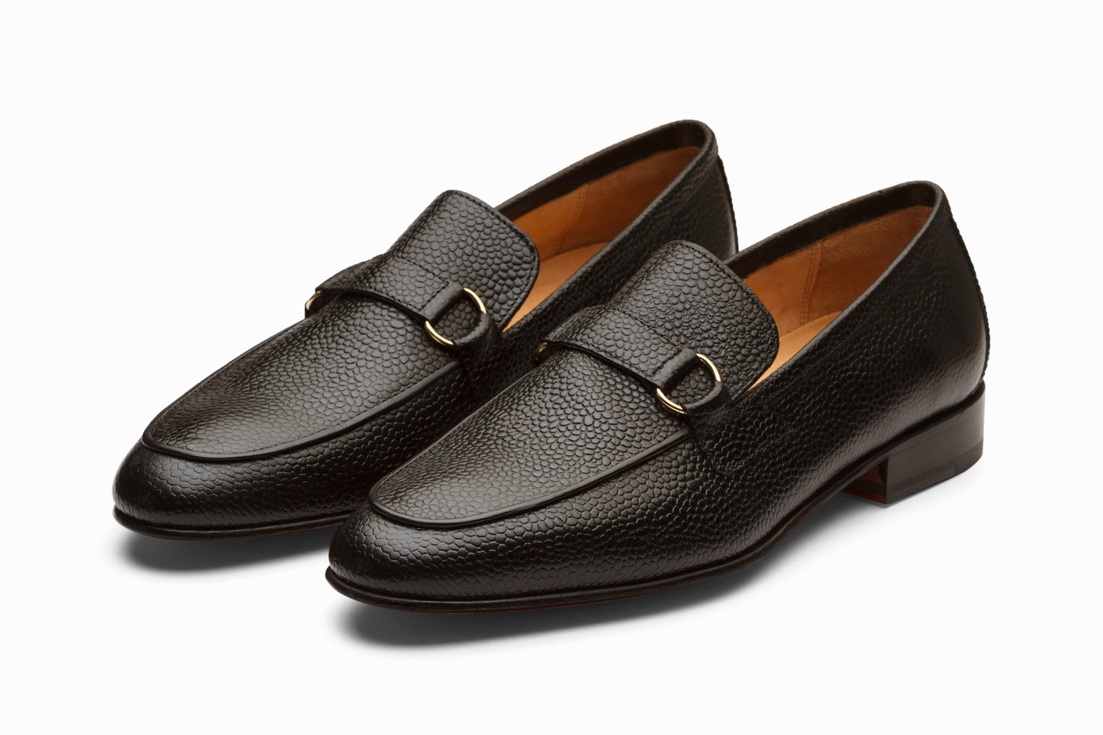 Black leather loafer viewed in full