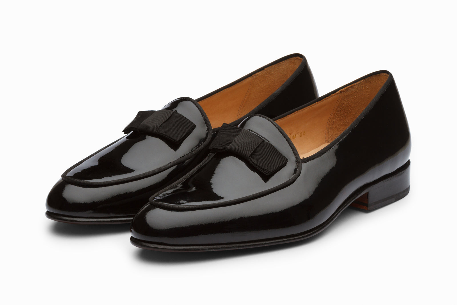 Black patent dress shoe viewed in full