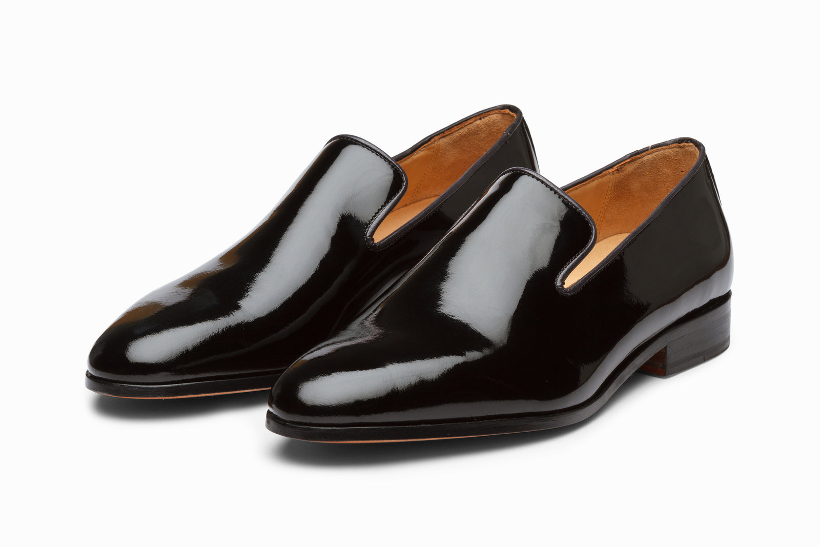 Black patent loafer viewed in full