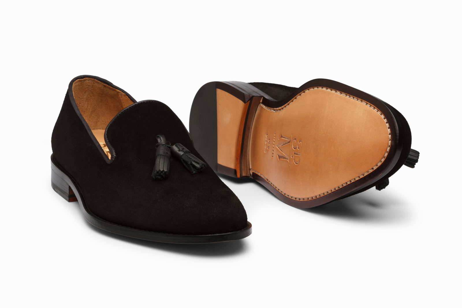 The black suede tassel in detail