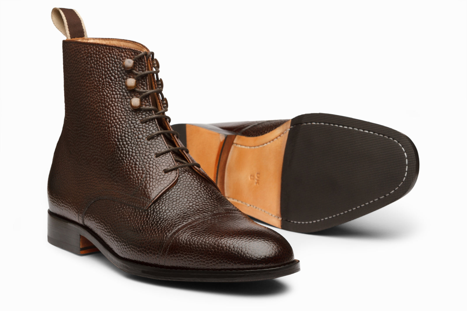 Close view of the brown leather boot