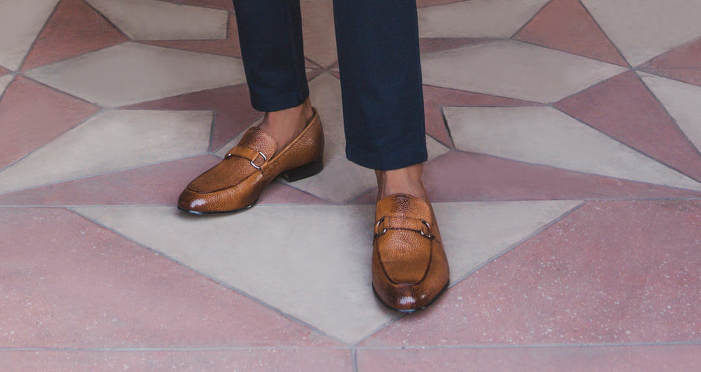 Brown leather loafer viewed in full