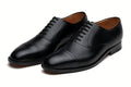 Pair of black leather oxford