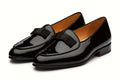 Pair of black patent dress shoe