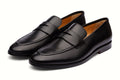 Pair of black leather loafer