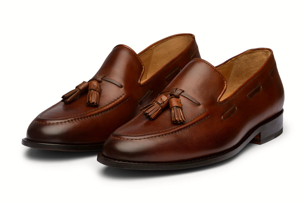 Pair of brown leather tassel