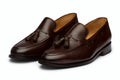 Pair of brown leather tassel